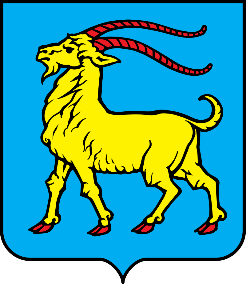u plavome na desno (heraldički) okrenuta zlatna/žuta koza s crvenim papcima i rogovima"