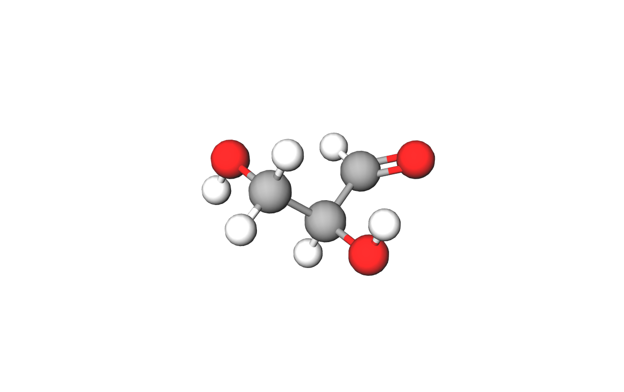 Fotografija prikazuje model molekule gliceraldehida (trioza), najmanje molekule ugljikohidrata načinjene od kuglica štapića. Tri atoma ugljika prikazana su kuglicama sive boje. Na njih se nadovezuje šest atoma vodika koji su prikazani kuglicama bijele boje i tri atoma kisika koji su prikazani kuglicama crvene boje.